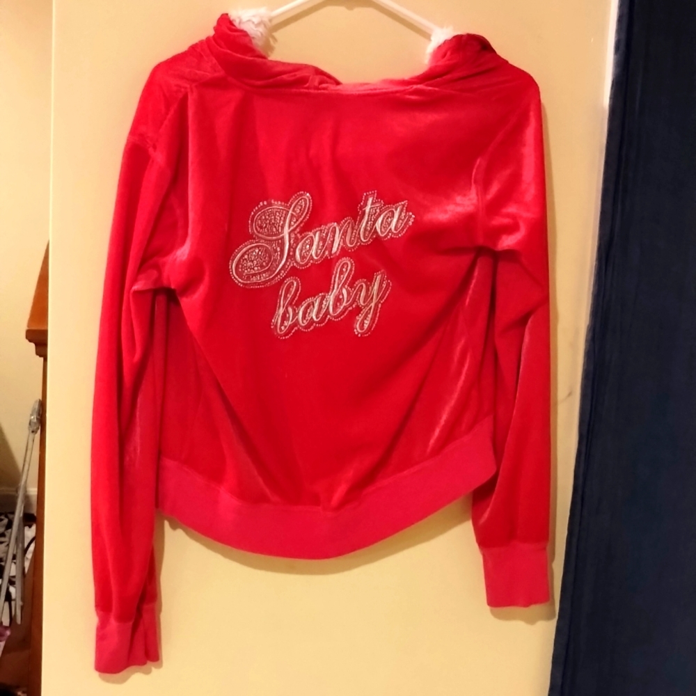 A bedazzled pink Victoria secret zip up.